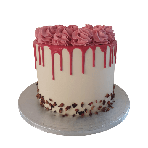 beautiful pink drip cake with buttercream