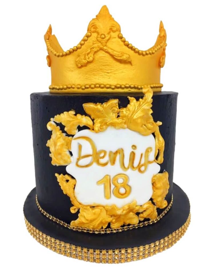 yellow and black crown cake