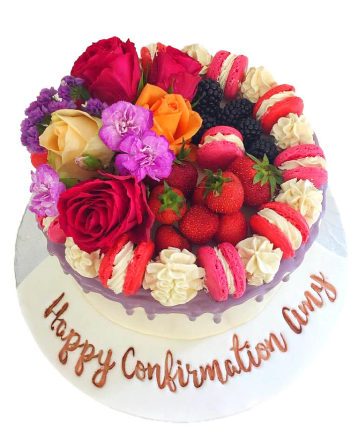 Flowers and macaroons confirmation purple drip cake 2