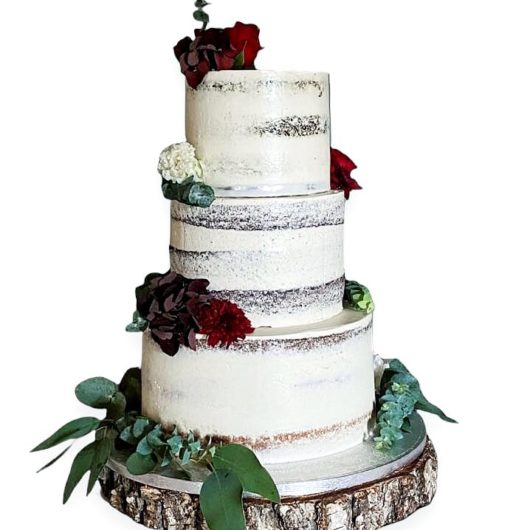 Beautiful Rustic Wedding Cake with Semi-Naked Finish, Eucalyptus, and Blossoms | Eve's Cakes, Dublin