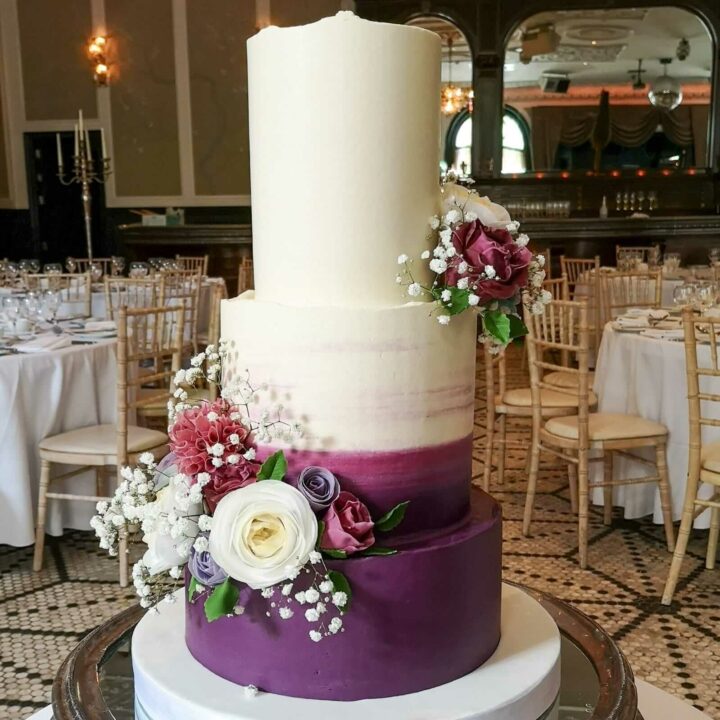 Unique Wedding Cake with Purple buttercream and wafer flowers