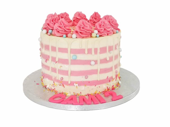 custom white cream cake with pink stripes and dots