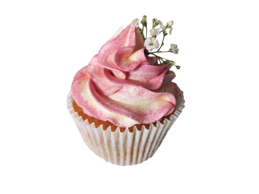 pink and white cream cupckae with small flower