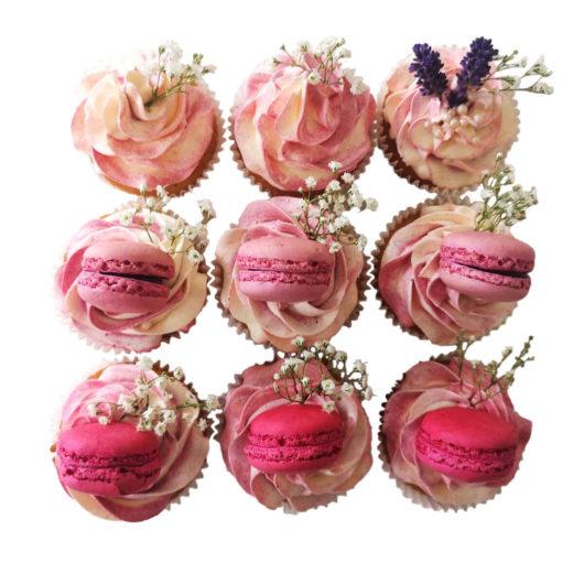 Twelve wedding cupcakes in pink box
