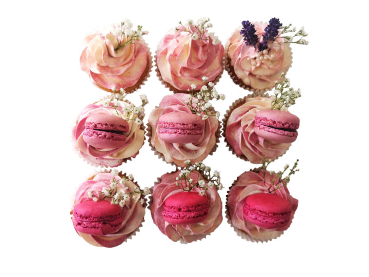 Twelve wedding cupcakes in pink box