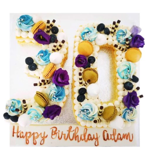 white, yellow, blue and purple 30th number cake