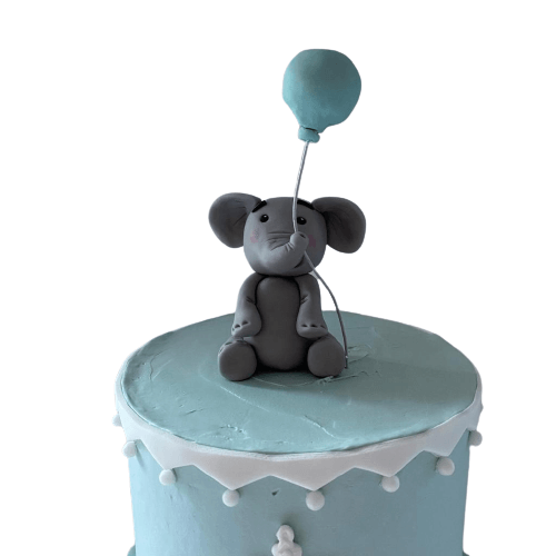 christening cake dublin in blue with fondant elephant holding balloon