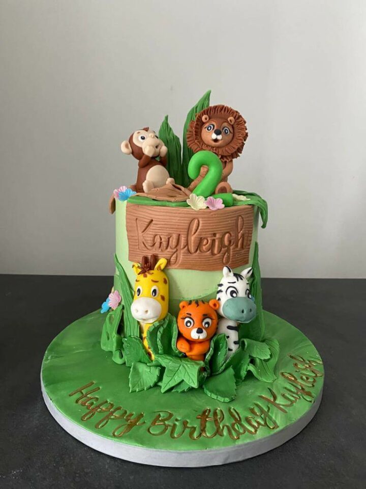 adorable jungle cake with lion, monkey and other jungle animals