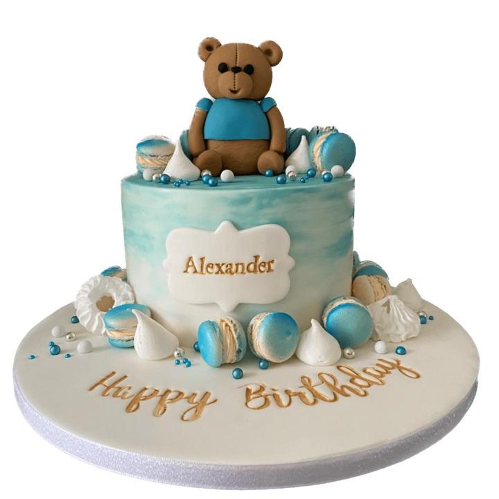 teddy bear cake in blue and macaroons
