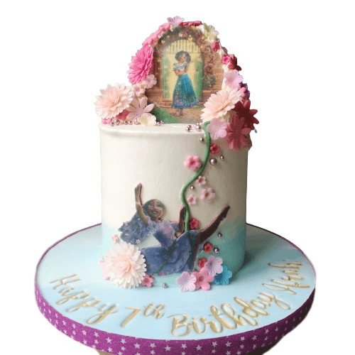Encanto Cake with edible images, and flowers cascading down the side of the cake.